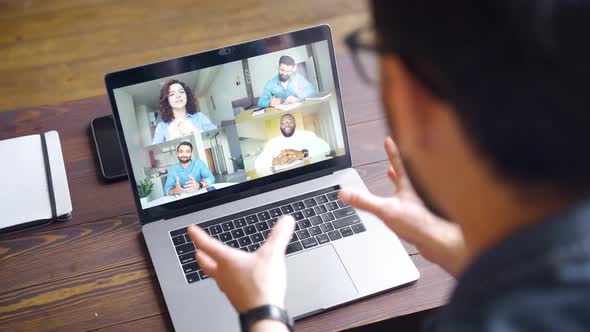 View of Business Man Talking to Colleagues About Plan During Video Conference