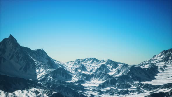 Aerial View of the Alps Mountains in Snow