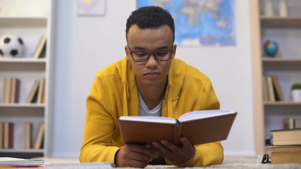 Overworked African-American Student Preparing for Test Feeling Lack of Energy