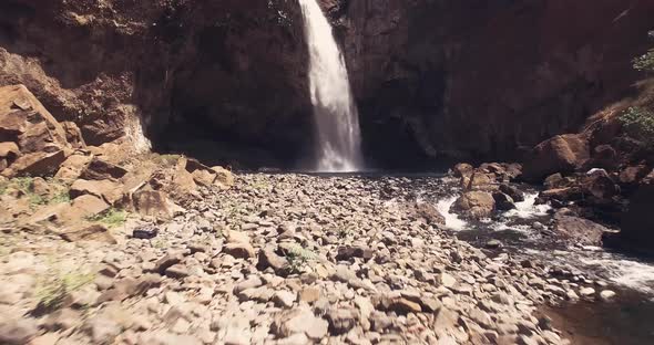 Drone fotoage closing into big waterfall