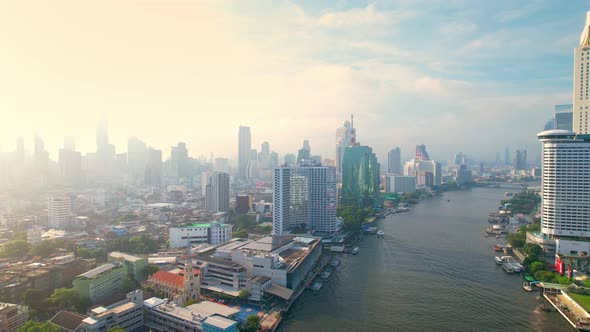 4K UHD : Aerial view over the Chao Phraya River and Buildings