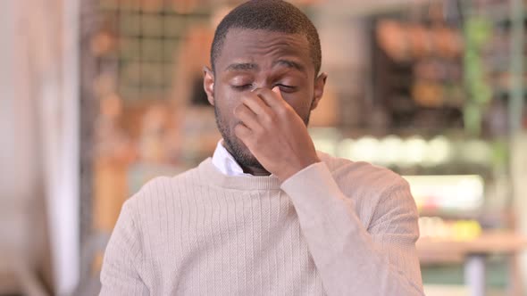 Portrait of Exhausted African Man Having Headache