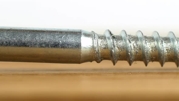 4K video slider screws and nails for renovation work. A close-up of a metal screw.