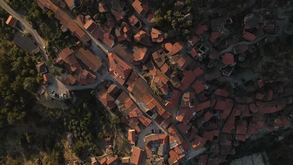 Aerial top-down orbit over roofs of Monsanto village, Portugal