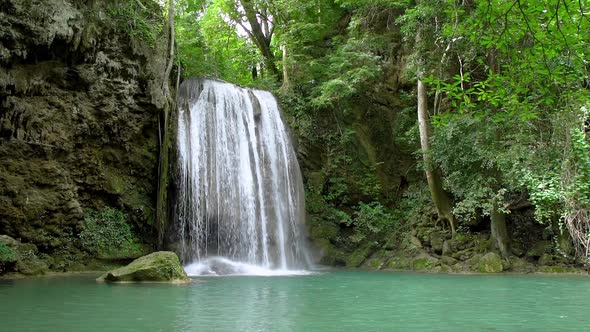 Erawan waterfall level three in National Park in Kanchanaburi, Thailand - Slow motion