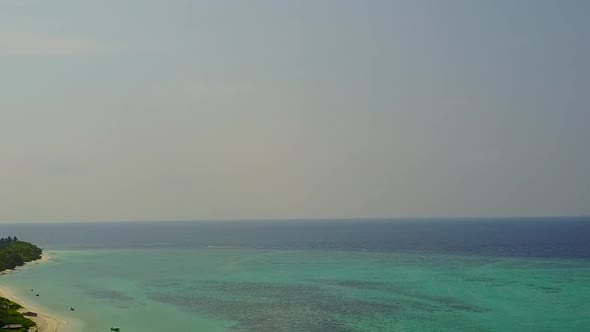 Aerial abstract of shore beach break by blue sea and sand background