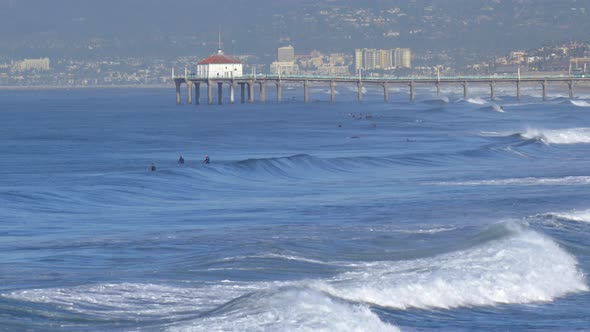 The Manhattan Beach Pier stands majestic over the Pacific Ocean.