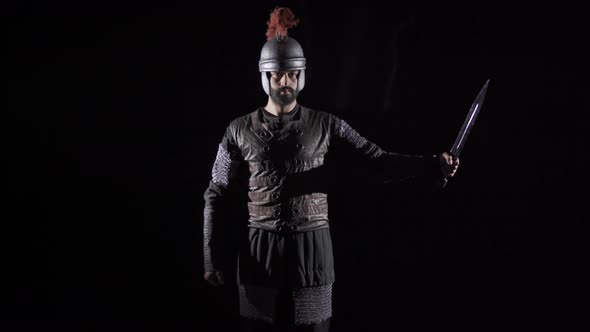 Ancient Roman knight. Black background. alt