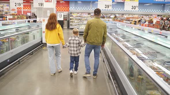 Consumerism Shopping Concept  Beautiful Caucasian Family Walk in the Supermarket