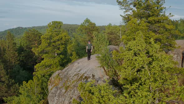 The tourist on the top of the mount The Krasnoyarsk Pillars