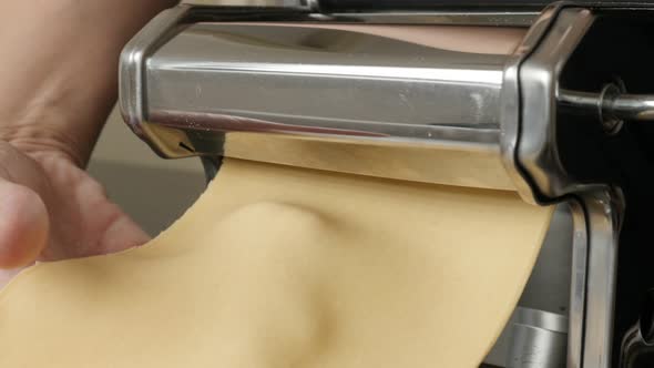 Italian lasagne making from dough 4K 2160p 30fps UltraHD footage - Manual pasta machine at home clos