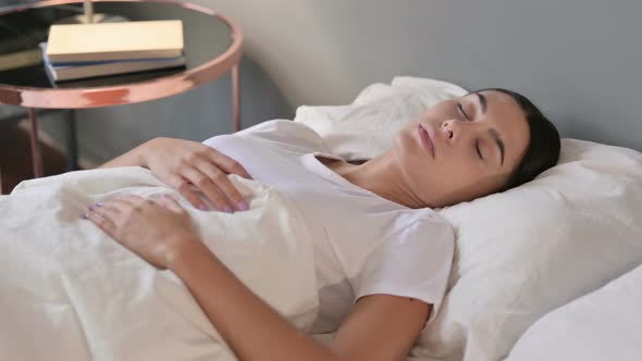 Peaceful Young Latin Woman Sleeping in Bed 