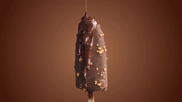 Chocolate Drop On Ice Cream While Rotating 