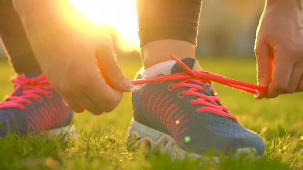 Running Shoes  Woman Tying Shoe Laces