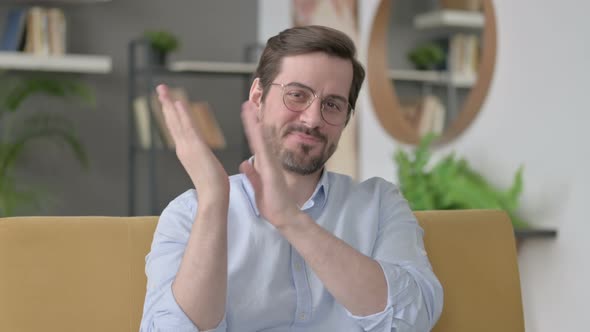 Portrait of Young Man Clapping Applauding