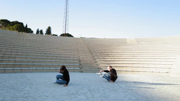 Man and woman couple dancers at outdoor theater