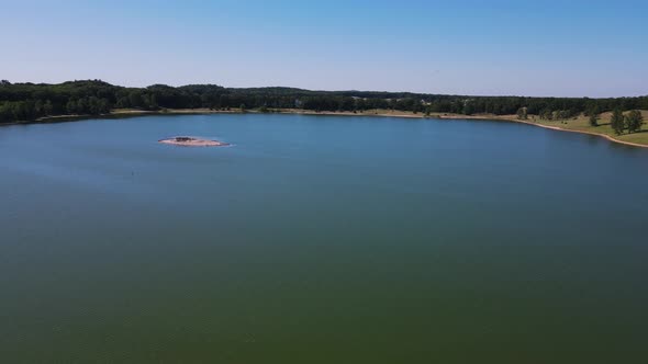 Spinning harshly to a lake near a factory.