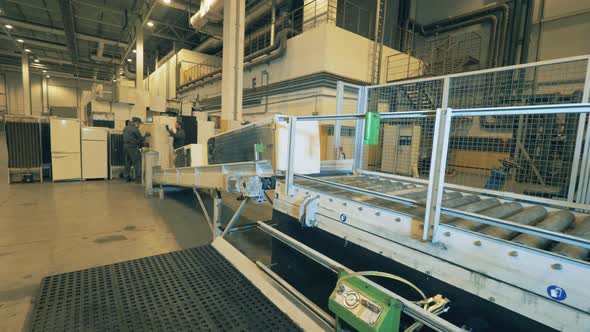 Discarded Refrigerators Are Being Loaded Onto the Conveyor