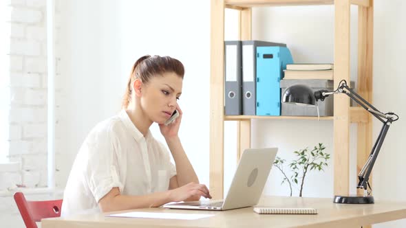 Woman Answering Call for Work, Talking to Customers