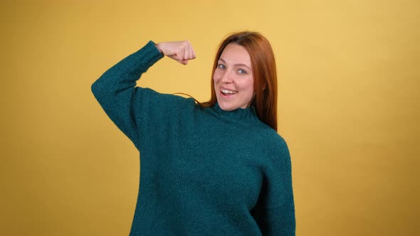 Young Red Hair Woman Posing Isolated on Yellow Color Background Studio