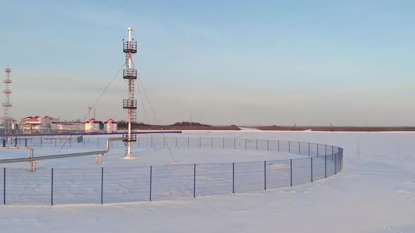 A Drone Flies Over an Emergency Gas Release Tower at an Oil and Gas Extraction and Treatment