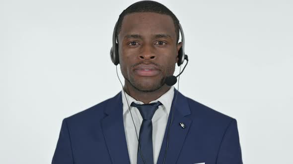 African Businessman with Headset for Call Center, White Background