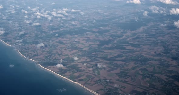 high altitude aerial coastal beach footage of English coastline by climate change and global warming