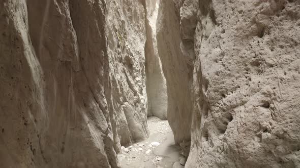 Drone Flying Through Narrow Canyon in Mountains