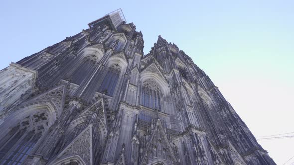 Cologne cathedral, camera is tracking backwards, lens flare. 4K