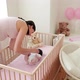Mother picking up crying baby from crib and comforting her - VideoHive Item for Sale