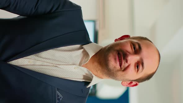 Young Man Project Manager Smiling in Front of Camera