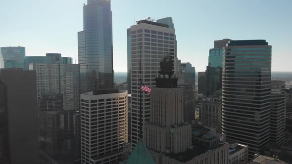 Aerial footage of America's flag, downtown Minneapolis behind