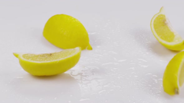 Lemon Divided Into Slice on a White Background. Slow Motion