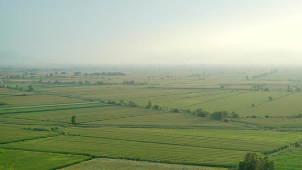 8K Wide Flat Plain Covered With Green Fields