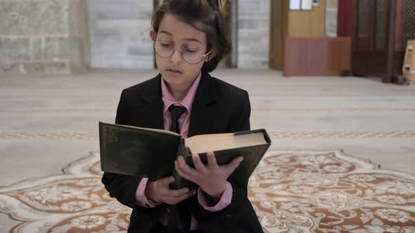 Boy Reading AlQur'an