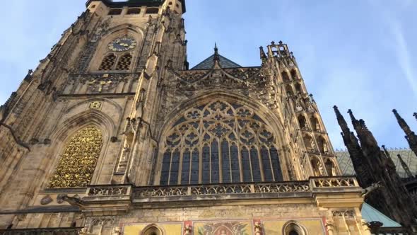 Approaching front gate of St Vitus Cathedral in Prague, tilt down