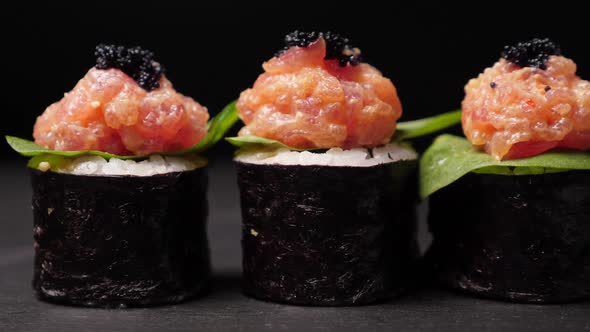 Sushi Rolls on Black Slate Board