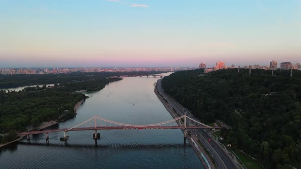 Aerial shot of the Dnipro river through the city of Kiev.