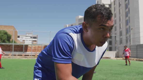 Soccer players having match on field