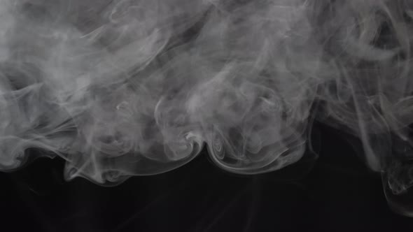 Smoke texture over blank black background. Mystical steam at night.