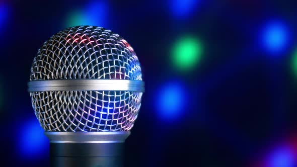 Microphone Moving on Blurred Bokeh Circles Background