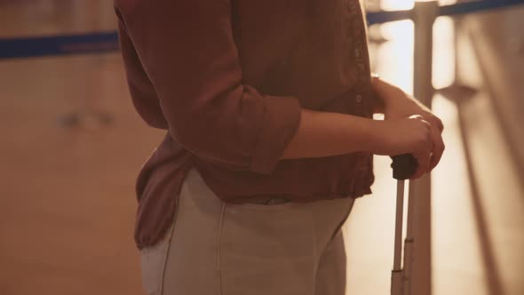 Tourist woman holding a suitcase