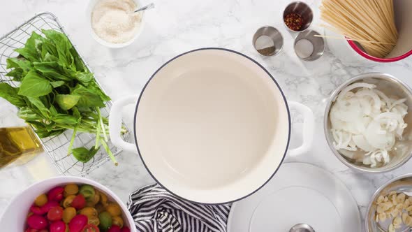 Flat lay. Step by step. Cooking on pot pasta recipe in an enameled cast iron dutch oven.