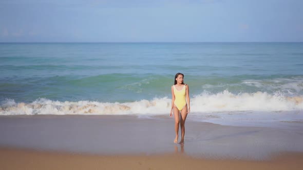 Asian woman enjoy around beautiful beach sea ocean