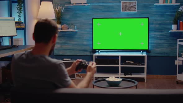 Guy with Green Screen Modern TV in Living Room