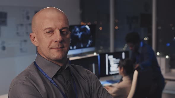 Caucasian Man Posing in Office at Night