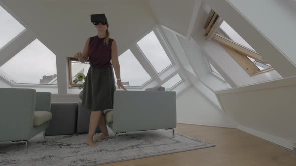 Woman entertaining with VR-headset in Cube House