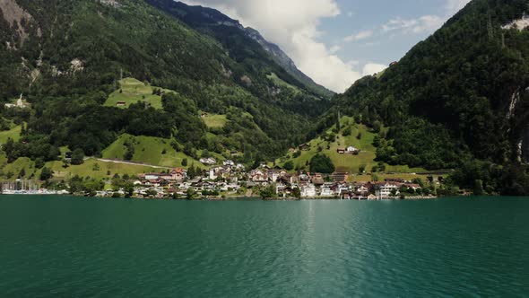 Modern Village in a Lowland Between the Alpine Mountains on the Lakeshore