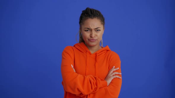 Offended African girl with braid hairstyle turning away from the camera