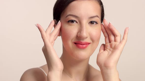 Beauty Brunette Model in Studio Alone with Ideal Shiny Skin Portrait